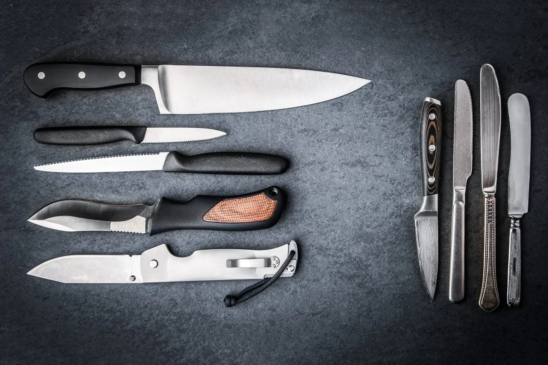 Collection of sharpened kitchen knives on stone Sharper Focus Ltd Bristol